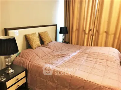 Cozy bedroom with elegant decor and soft lighting, featuring a comfortable bed and stylish bedside lamps.