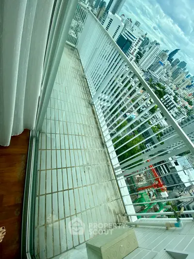 Spacious balcony with stunning city skyline view, perfect for urban living.