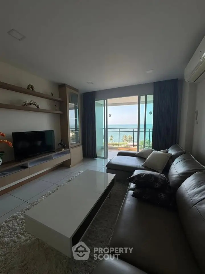Modern living room with sea view and stylish furniture