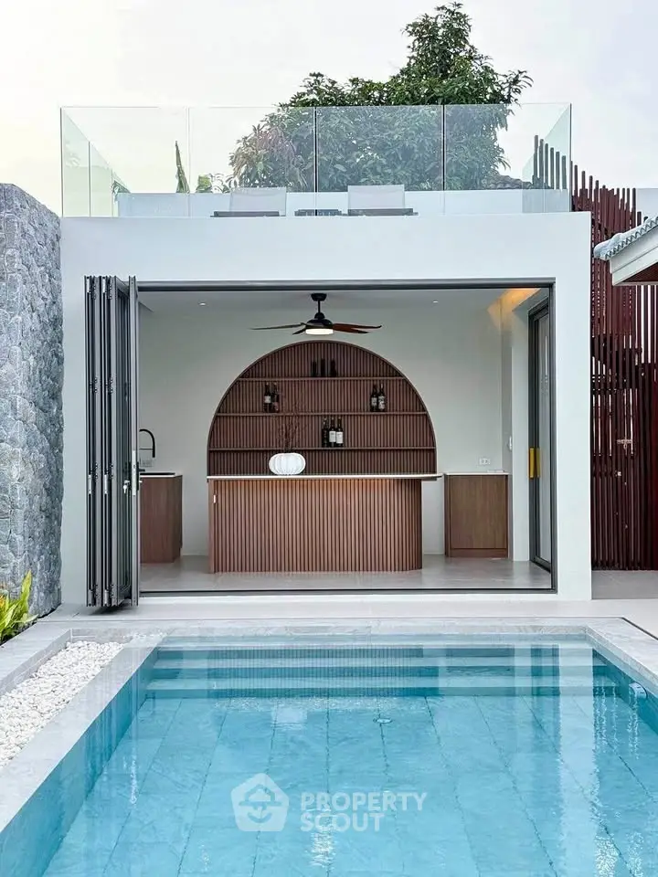 Modern poolside bar with sleek design and rooftop seating, perfect for entertaining.