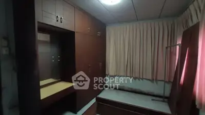 Spacious bedroom with built-in wardrobe and natural light