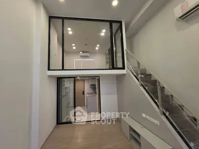 Modern loft apartment with mezzanine and sleek staircase