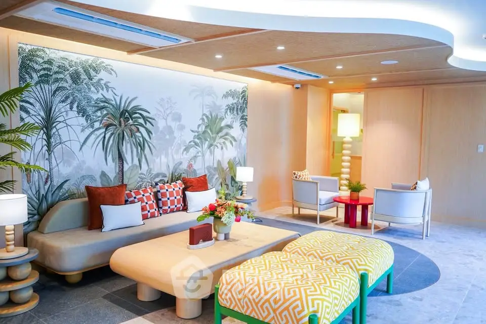 Luxurious living room with modern decor and tropical wallpaper, featuring elegant furniture and ambient lighting.