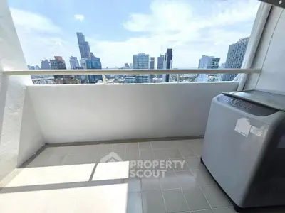 High-rise balcony with city skyline view and washing machine, perfect for urban living.