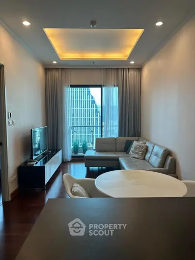 Modern living room with city view, stylish furniture, and elegant lighting.