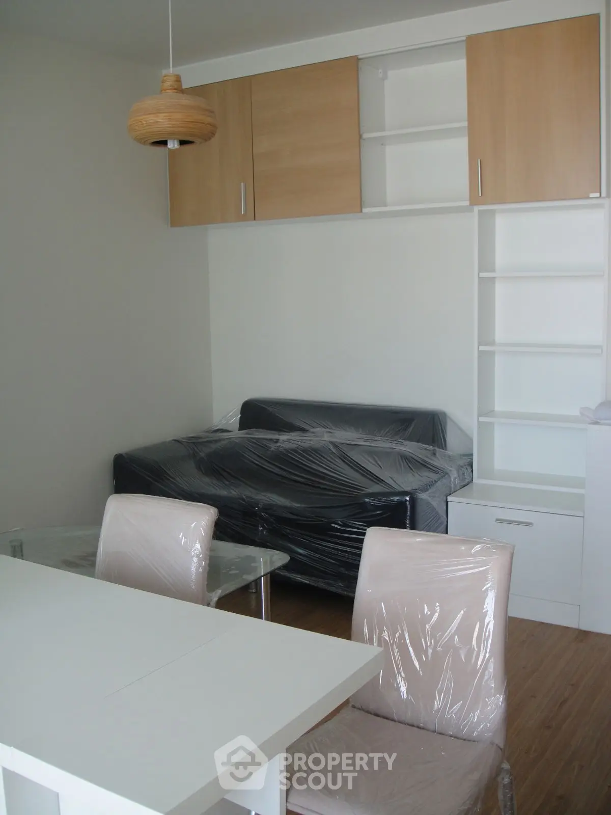 Modern living room with sleek furniture and stylish lighting in a contemporary apartment.