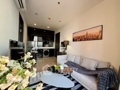Modern living room with stylish decor and open kitchen layout
