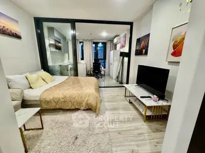 Modern studio apartment with stylish decor and open layout in urban setting.
