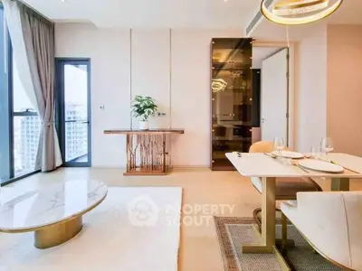 Luxurious modern living room with elegant dining area and large windows offering city views.