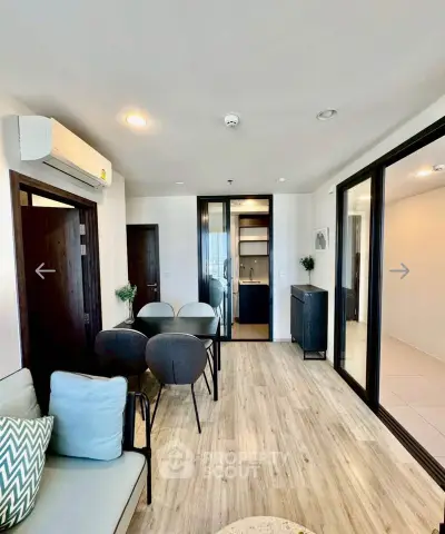 Modern living room with open layout and stylish decor in a contemporary apartment.