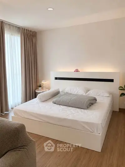 Modern bedroom with elegant decor and natural light