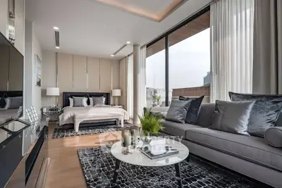 Luxurious modern bedroom with large windows and elegant decor in a high-end apartment.