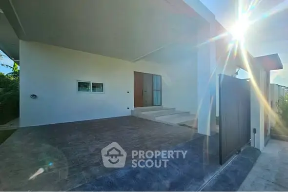 Modern home entrance with sleek design and sunlit ambiance