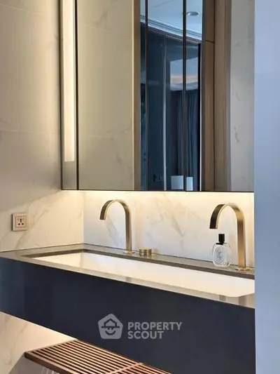 Luxurious modern bathroom with sleek double sink and elegant lighting