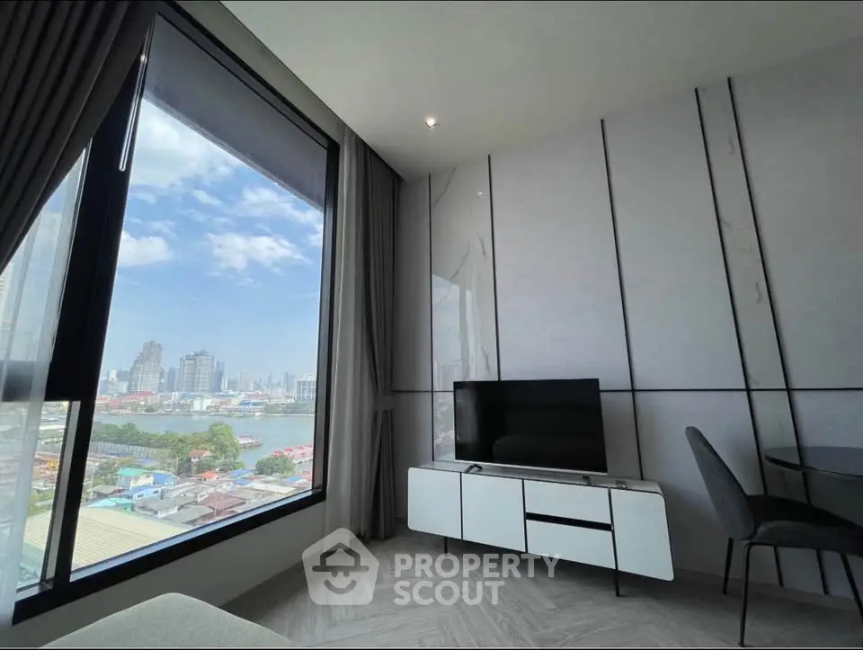 Modern living room with panoramic city view and sleek furniture
