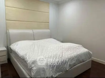 Luxurious bedroom with elegant bed and soft lighting, perfect for relaxation and comfort.