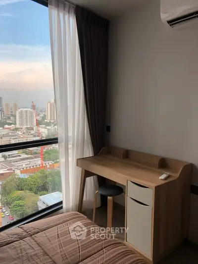 Modern bedroom with city view and stylish wooden desk