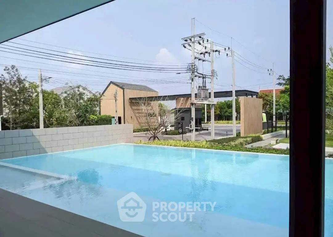 Luxurious outdoor pool with serene surroundings and modern architecture.