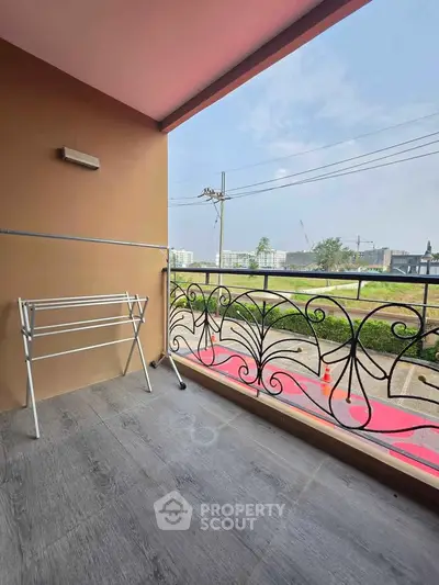 Charming balcony with decorative railing and scenic view, perfect for relaxation and enjoying the outdoors.