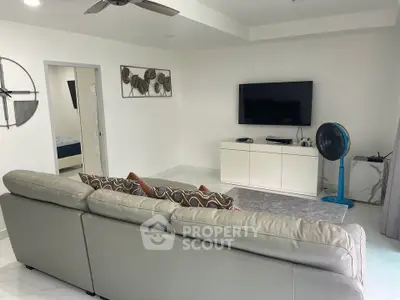 Modern living room with sleek TV setup and comfortable seating