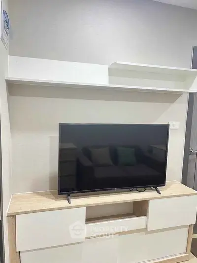 Modern living room with sleek TV unit and minimalist decor
