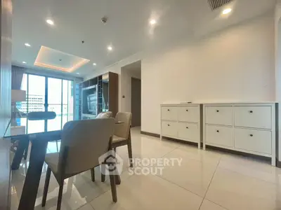 Spacious modern living room with elegant dining area and large windows