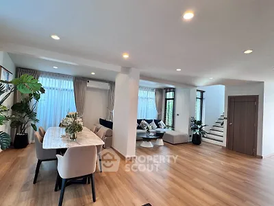 Spacious modern living room with elegant dining area and stylish decor