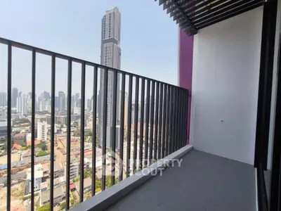 Modern balcony with stunning city skyline view in high-rise apartment.