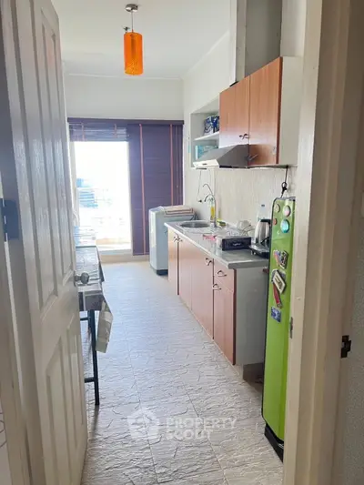 Charming kitchen with natural light, featuring modern appliances and ample storage, perfect for culinary enthusiasts.