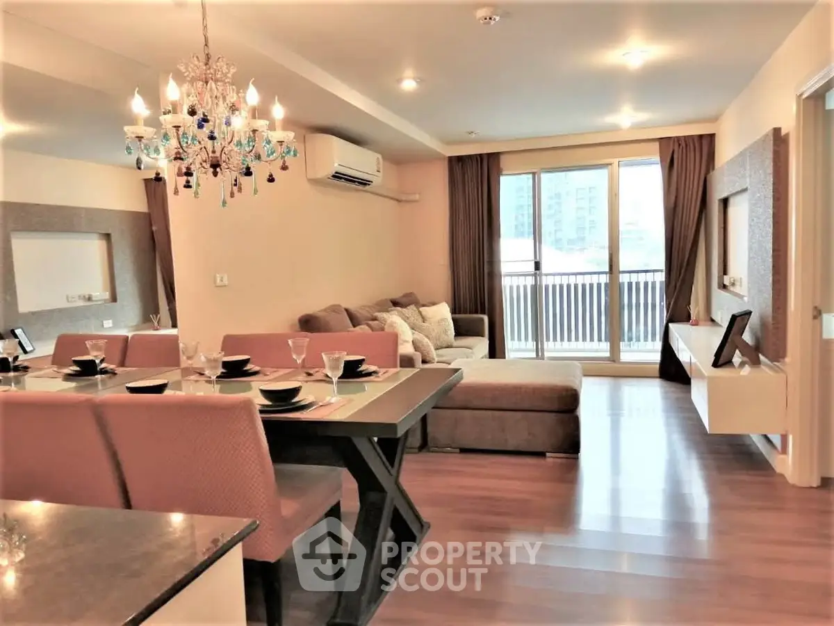 Elegant living room with modern decor and large windows in a stylish apartment.