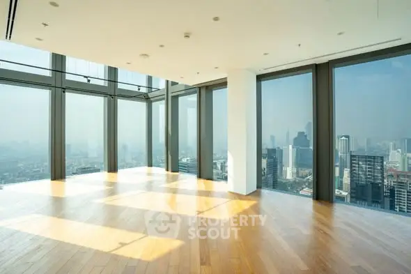 Stunning corner unit with panoramic city views and floor-to-ceiling windows in a modern high-rise.