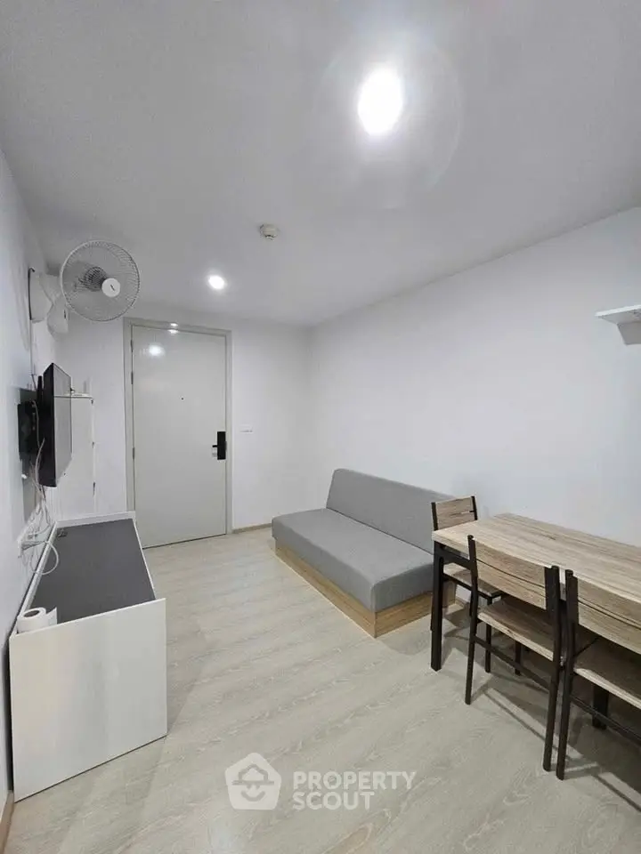 Modern minimalist living room with sleek furniture and neutral tones, perfect for cozy urban living.