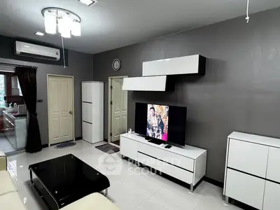 Modern living room with sleek furniture and stylish lighting