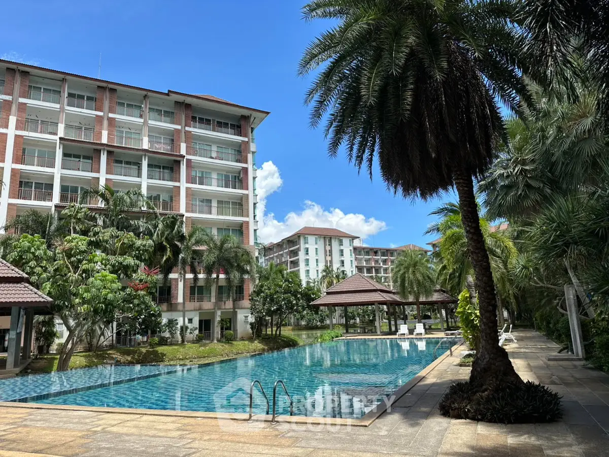 Luxurious condominium with stunning pool and lush landscaping, perfect for relaxation and leisure.