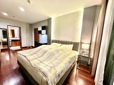 Luxurious bedroom with modern decor and ambient lighting in upscale apartment