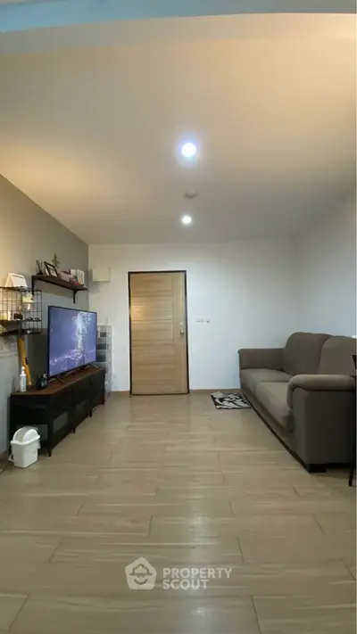 Spacious living room with modern decor and cozy seating area