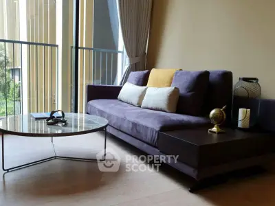 Modern living room with stylish sofa and coffee table near large window