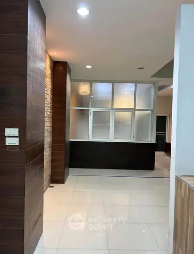 Modern interior with sleek design and elegant finishes, featuring a spacious layout and stylish lighting.