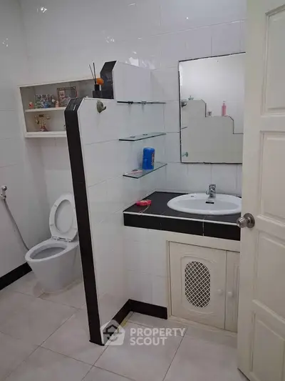 Spacious bathroom with modern fixtures and ample storage space