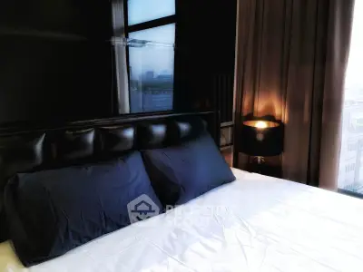 Luxurious bedroom with city view and elegant lighting in modern apartment