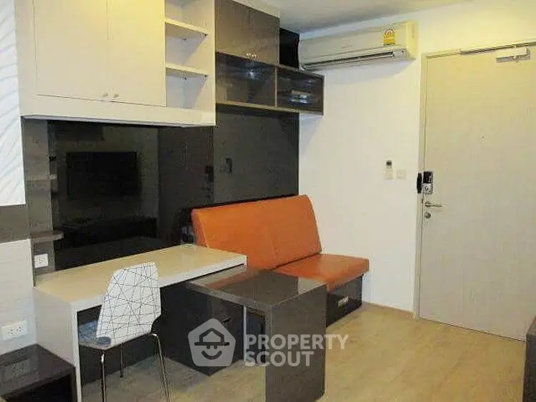 Modern compact living room with built-in furniture and air conditioning