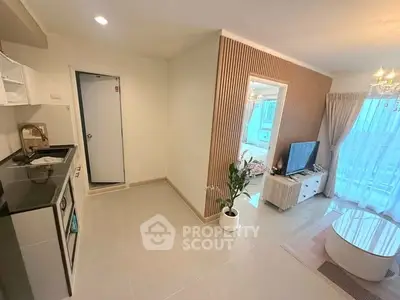 Modern open-plan living room with stylish kitchen and large windows