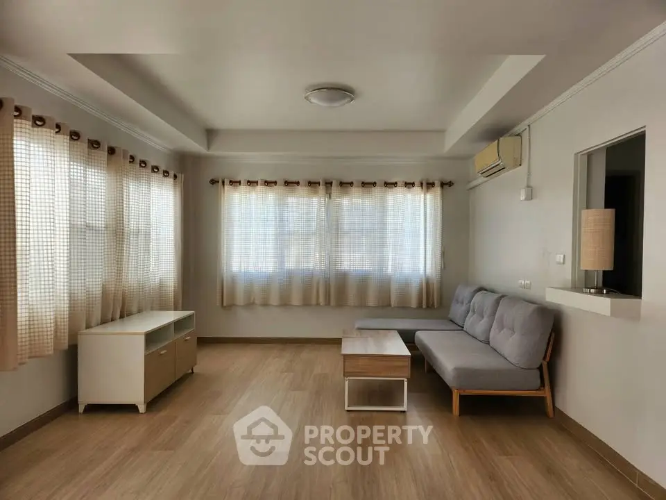 Spacious living room with modern furniture and natural light