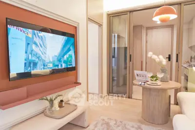 Modern living room with wall-mounted TV and stylish decor