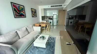 Modern living room with stylish decor and open kitchen layout