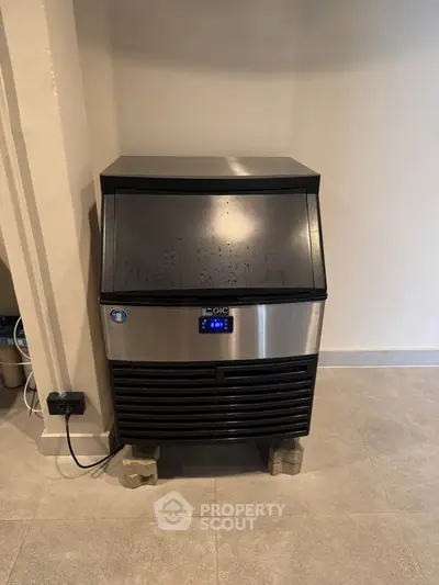 Commercial ice maker in a modern kitchen setting, perfect for restaurants or large households.