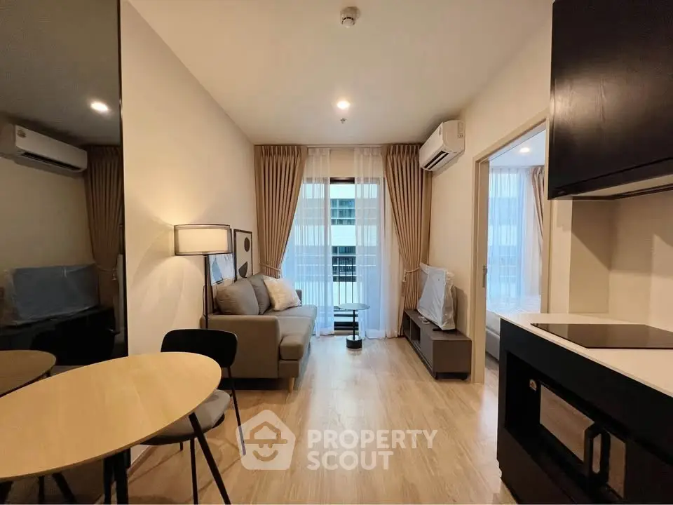 Modern living room with cozy sofa and dining area in stylish apartment.