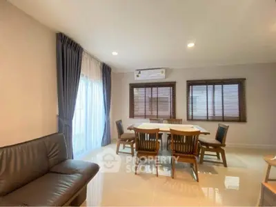 Spacious dining area with elegant furniture and natural light