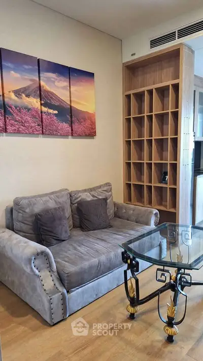 Stylish living room with cozy sofa and modern glass coffee table