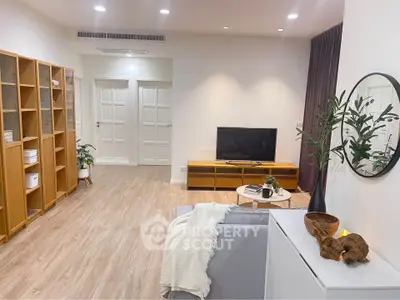 Modern living room with stylish decor and wooden flooring